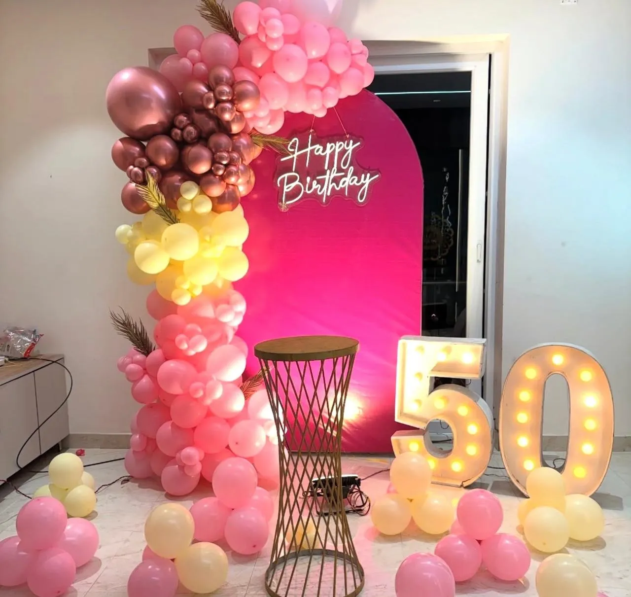 50th Birthday Decor with balloons , neon light, LED age number and cake stand.