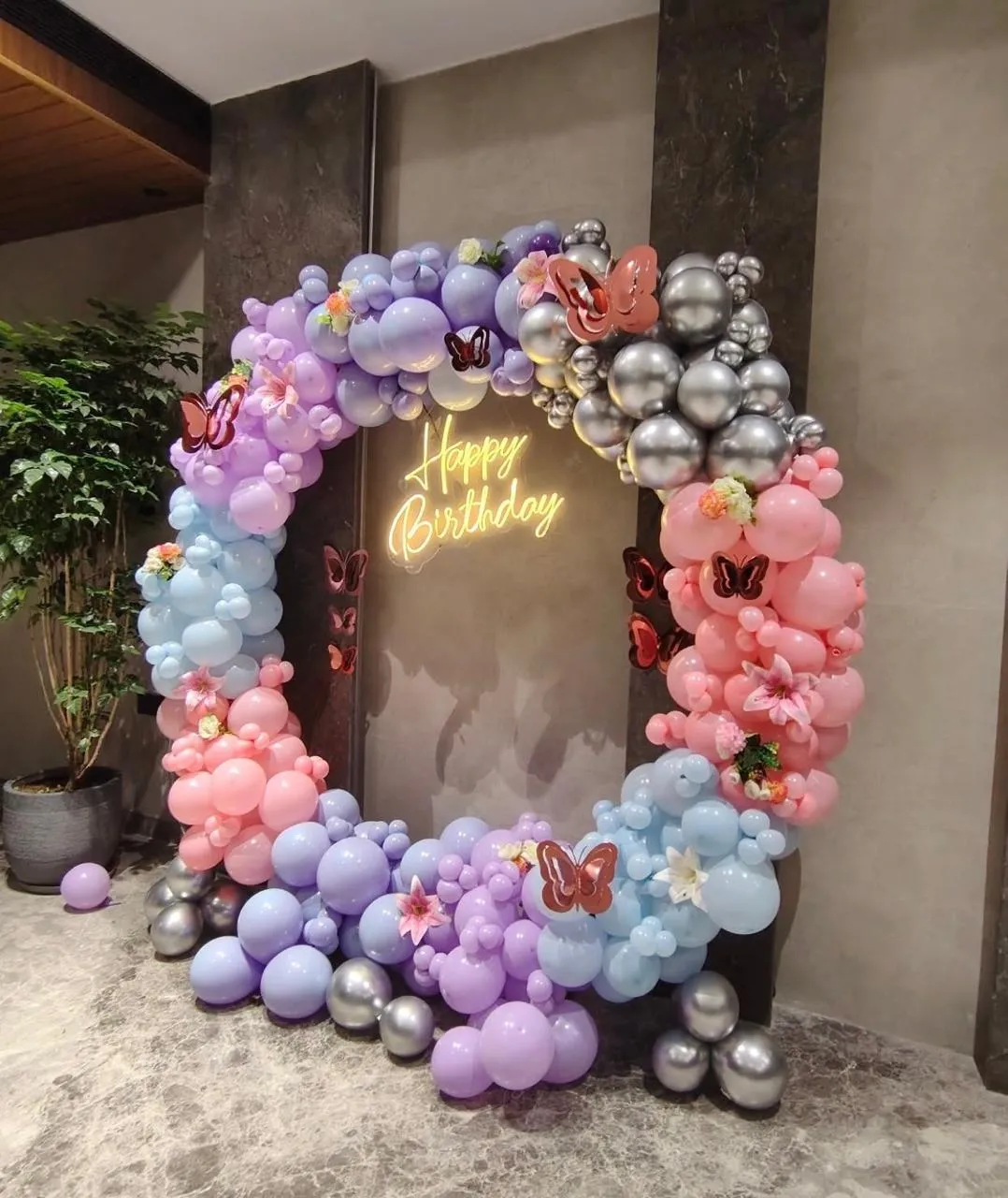 Butterfly Theme Decor with balloons , Happy Birthday neon light and cake table & stand.