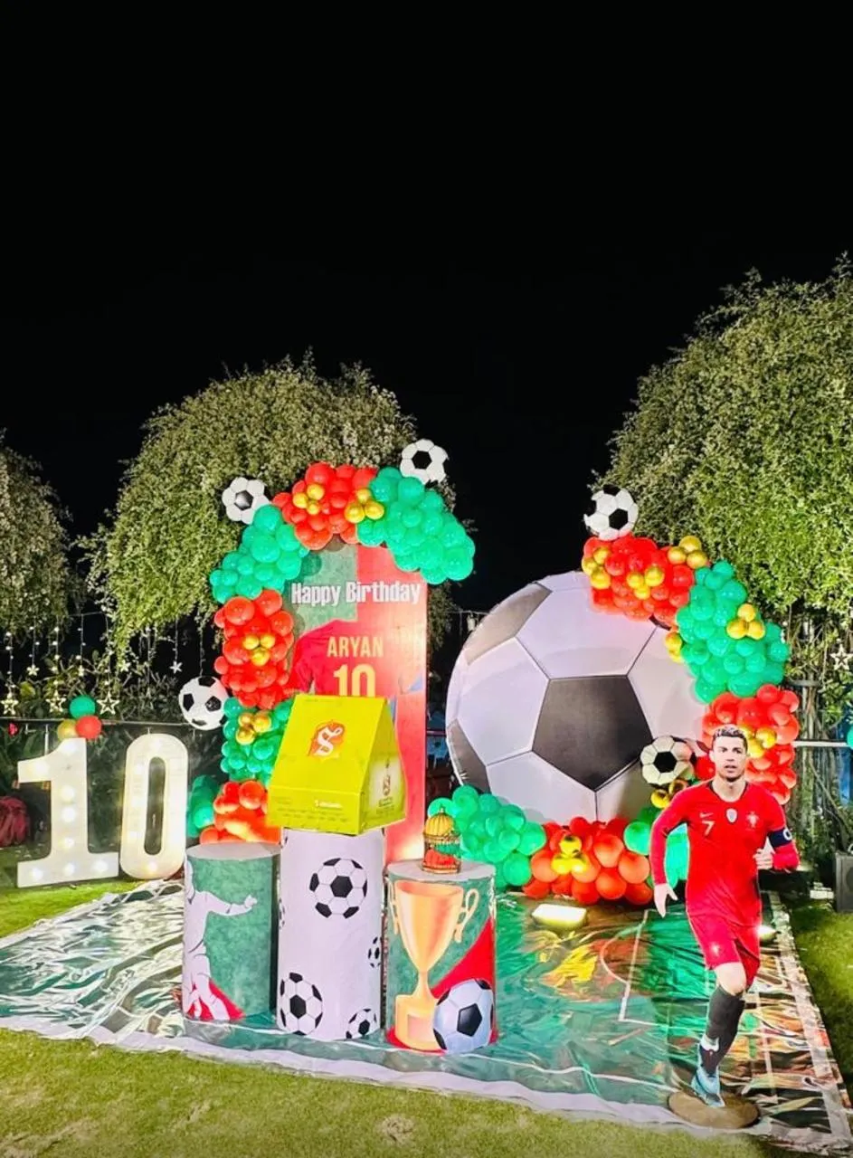 Football Theme with balloons, 3 round cake boxes, LED age, welcome board and 4 LED lights.