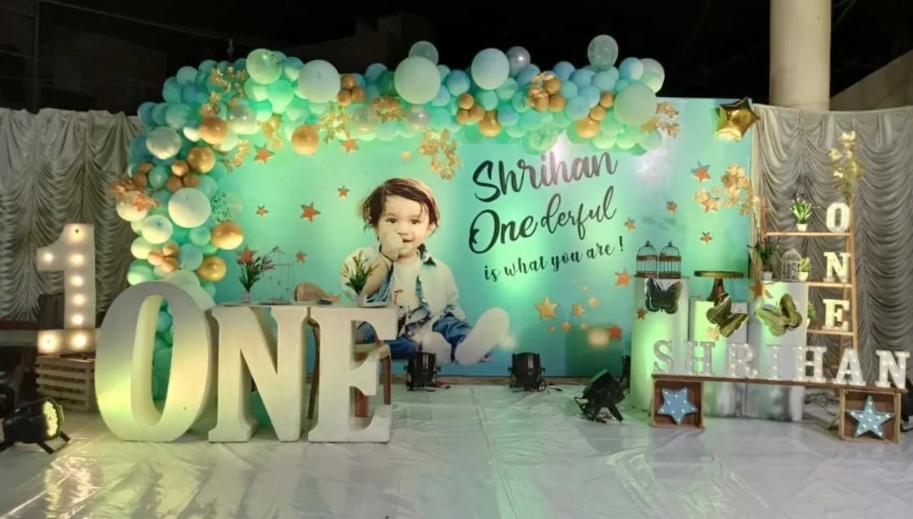 Onederful Theme with balloons, LED( name & age), cake table, artifical leafs, welcome board andlights.
