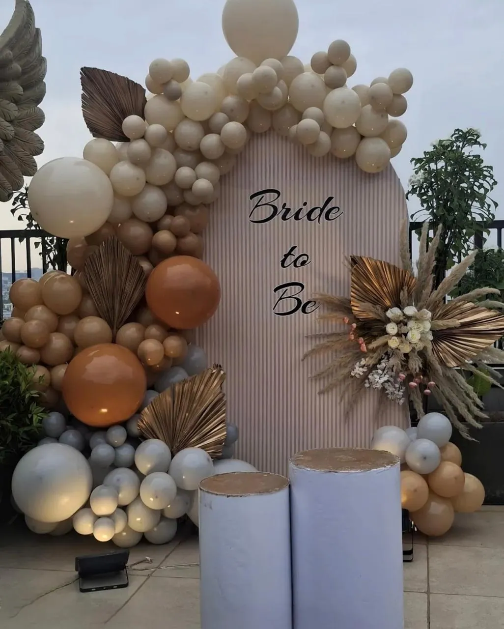Neutral boho balloon arch with pampas grass