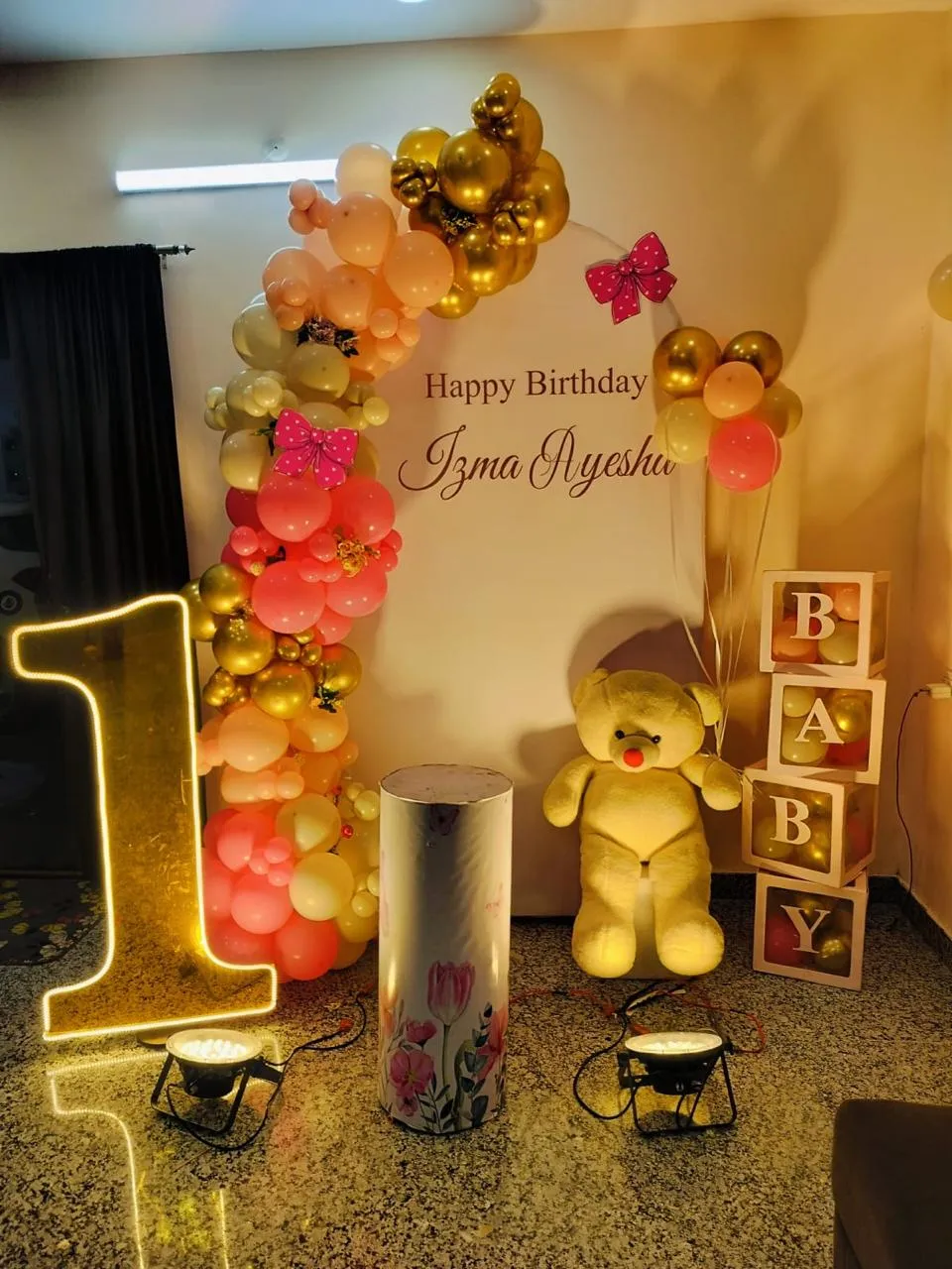 Pink bow theme with baloons , flowers , age light and enjanced lights.